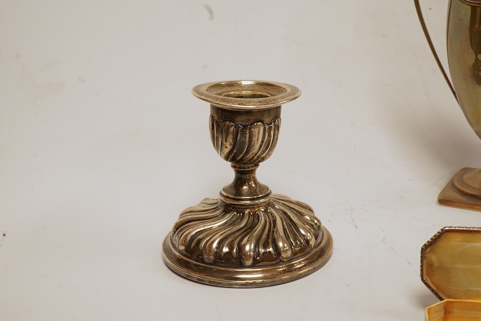 A George III silver helmet shaped cream jug, London, 1796, 14.7cm, together with two silver topped glass scent bottles, one Victorian, a pair of late Victorian silver dwarf candlesticks, London, 1895, a silver mounted ha